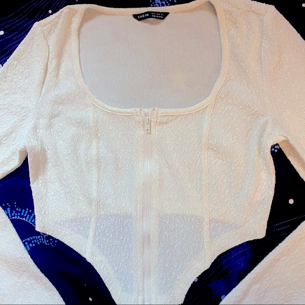 Cream textured asymmetrical crop top zip closure